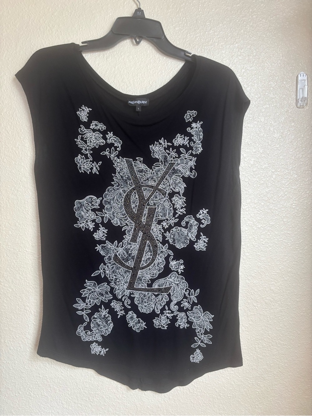 Yves Saint Laurent Black Tee with White Floral YSL Emblem